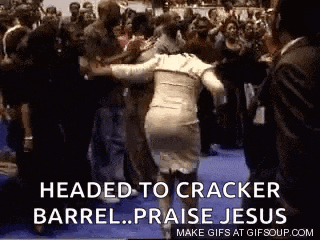 a woman in a white dress is dancing in front of a crowd .