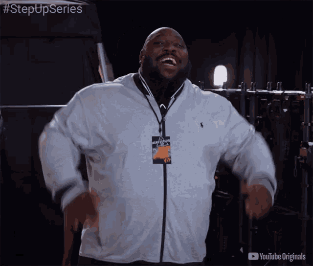 a man wearing a lanyard with a tag that says step up series