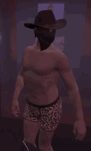 a shirtless man wearing a cowboy hat and shorts
