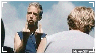 a man is giving the middle finger to another man in a video .