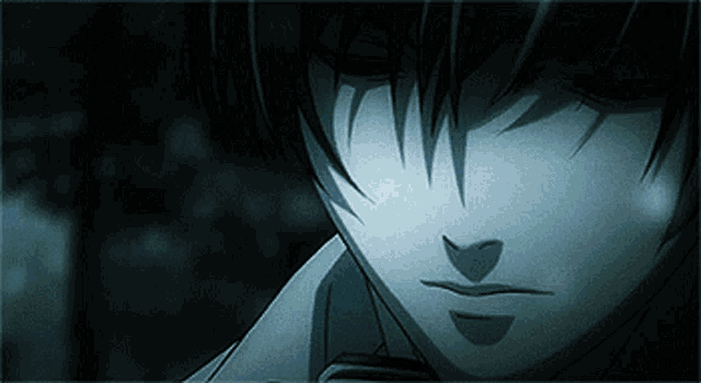 a close up of a person 's face with a shadow