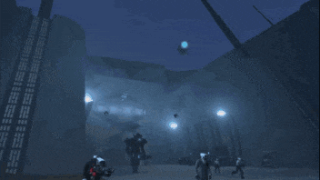 a man is standing in front of a giant robot