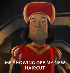 shrek from shrek is showing off his new haircut and looking at the camera .