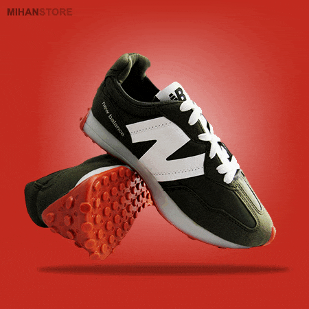 a pair of black and white new balance shoes with red soles