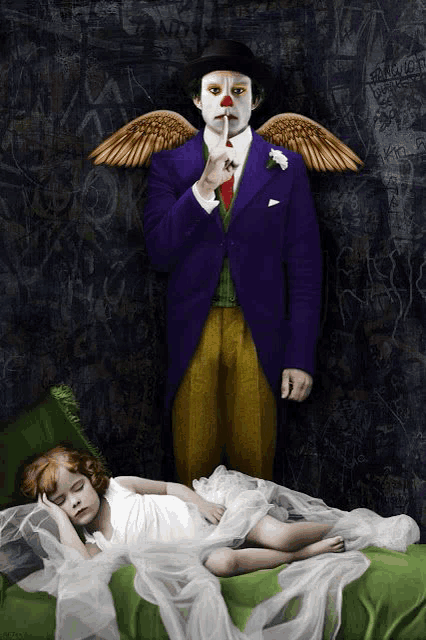 a clown with wings is standing next to a sleeping girl