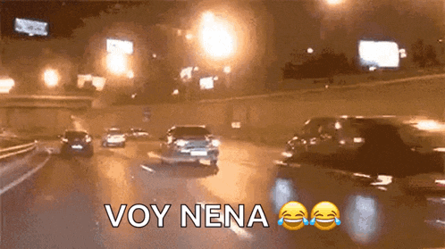 a picture of a highway at night with the words voy nena written on it
