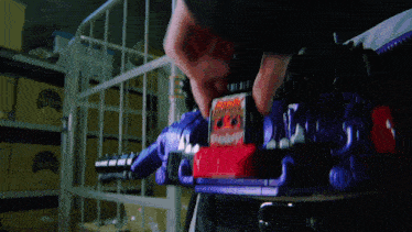 a person is playing with a toy that says ' apocalypse ' on it