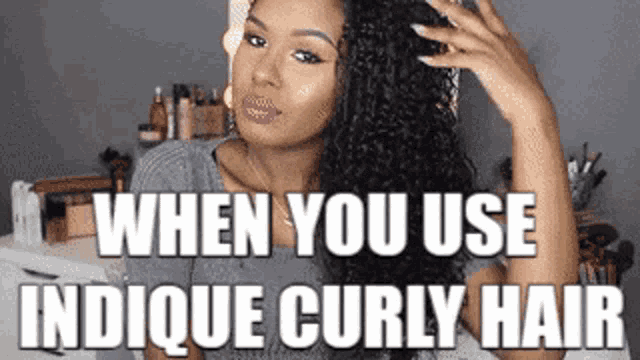 a woman with curly hair is standing in front of a table with the words `` when you use indicque curly hair ''