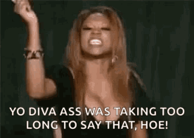 a woman is holding a microphone in her hand and saying yo diva ass was taking too