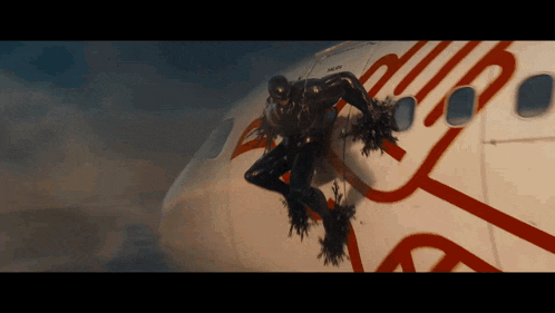 a comic book character is crawling on a virgin plane