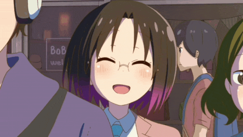 a girl with glasses is smiling in front of a bob wel sign