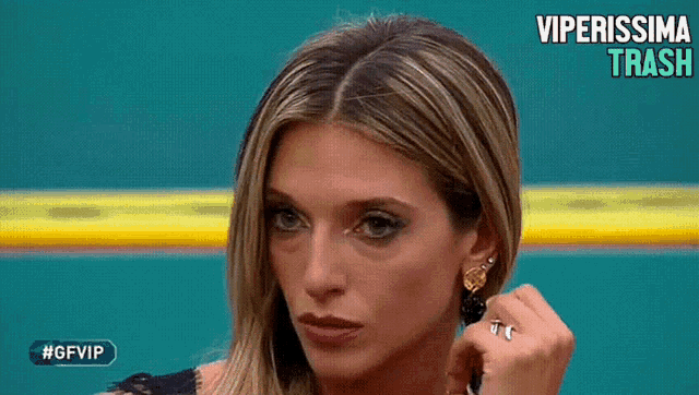 a close up of a woman 's face with #gfvip written on the bottom left