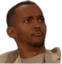 a man with a beard is making a funny face and looking up .