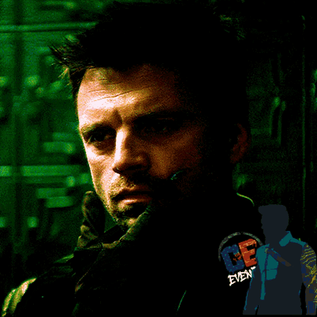 a man 's face is shown with a silhouette of a man with the letter e on his back