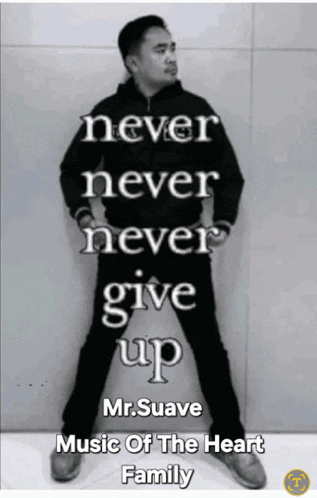a man stands in front of a wall with the words never never never give up