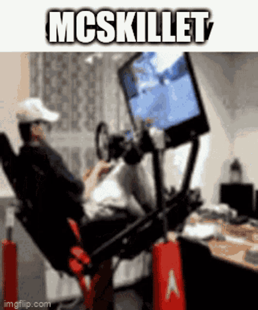a man sitting in a chair playing a video game with the words mcskillet above him