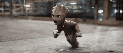 groot is a baby from guardians of the galaxy running on the street .