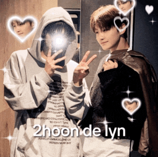 a couple of people standing next to each other with the words 2hoon de lyn on the bottom right