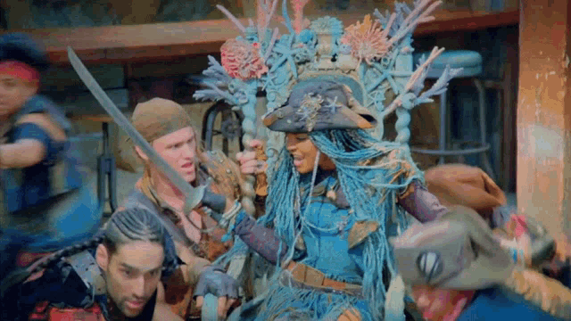 a group of people in pirate costumes are holding swords