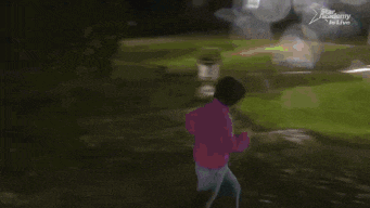 a girl in a purple sweater is running down a sidewalk in front of a star academy in live sign