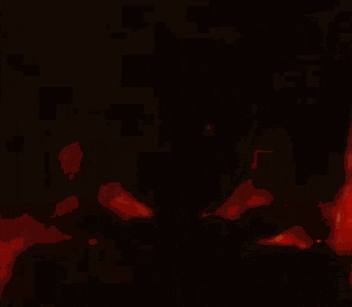 a silhouette of a man in a cowboy hat is surrounded by flames