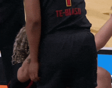 a person wearing a black te-biasu shirt