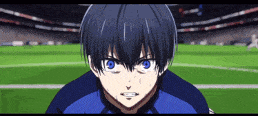 a soccer player with blue eyes is looking at the camera