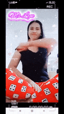 a woman is sitting on a red pillow with the name mrs. lyn on the screen