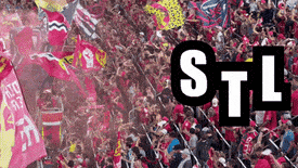 a crowd of people in a stadium with the word stl on the bottom right