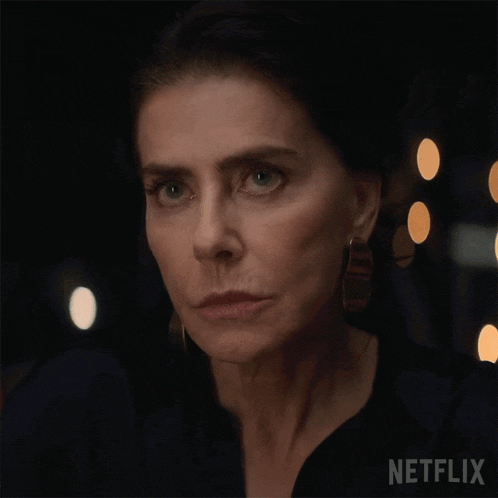 a close up of a woman 's face says come