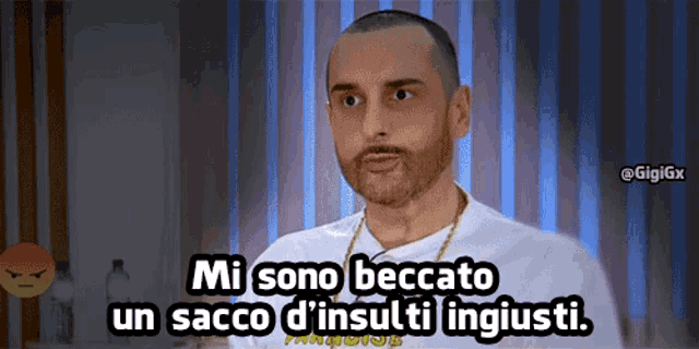 a man in a white shirt says mi sono beccato un sacco d' insulti ingiusti