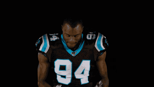 a football player with the number 94 on his shirt