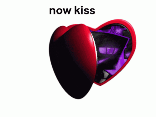 a heart shaped mirror with a picture of a man and the words now kiss below it