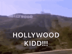 a picture of the hollywood sign on a hill with the words hollywood kidd written on it .