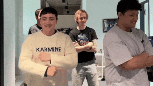 a man wearing a karmine shirt is dancing