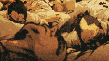 a group of men are laying on a bed with their heads down