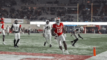 a football player in a red uniform with the number 19 on it