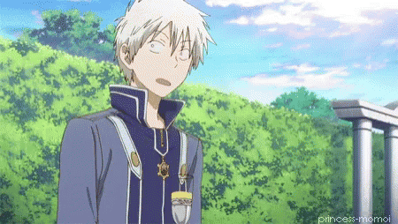 a man with white hair is making a funny face while standing in front of trees
