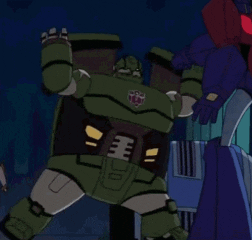 a cartoon drawing of a robot with the letter t on it