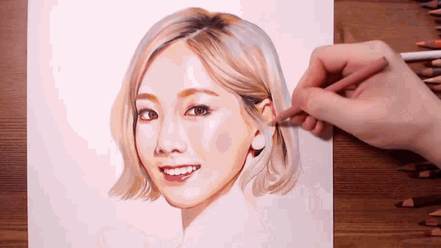 a person is drawing a woman 's face with a pencil