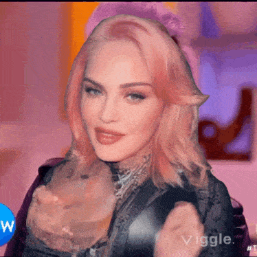 a close up of a woman with pink hair and the word vigge on the bottom right