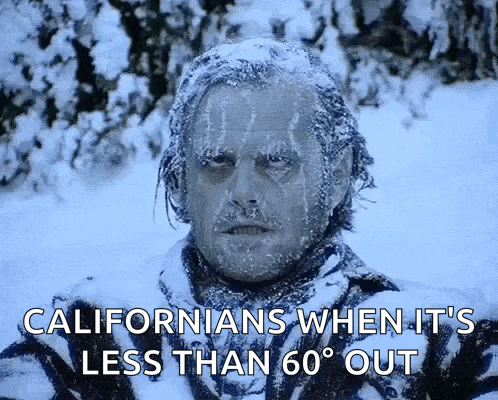 a man is covered in snow with the words californians when it 's less than 60 degrees out below him