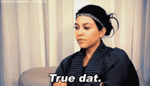a woman is sitting on a couch and saying true dat