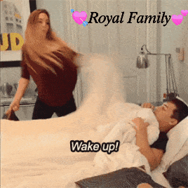 a woman standing next to a man on a bed with the words royal family written above them