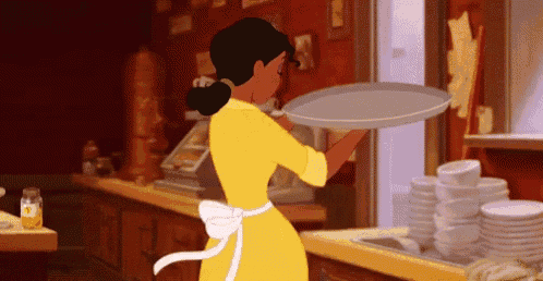 a woman in a yellow dress is holding a tray in her hand