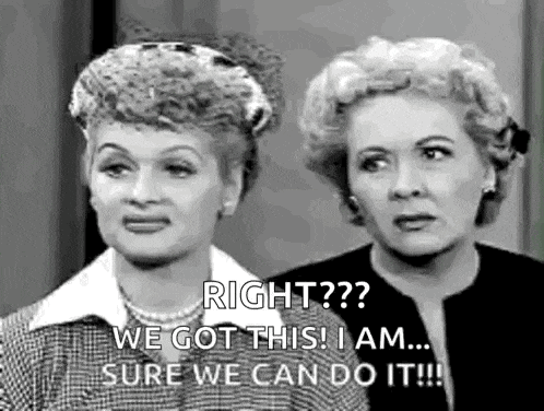 two women are standing next to each other and talking .