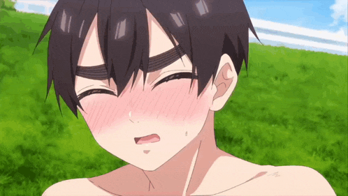 a close up of a boy 's face with his mouth open and his eyes closed .