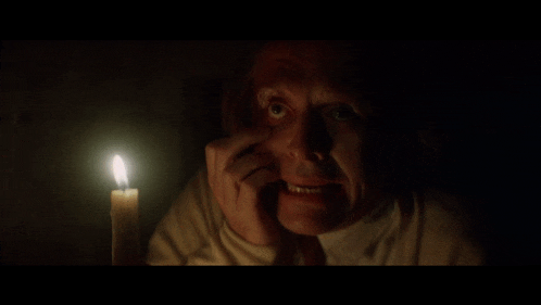 a close up of a man 's face in the dark