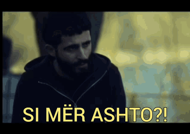 a man with a beard and the words si mer ashto on the screen