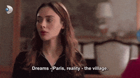a woman in a black shirt is talking about dreams paris reality and the village